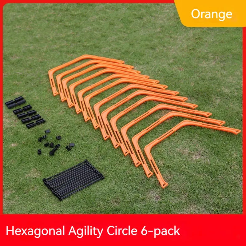 Set of six foldable yellow green and orange hexagon football agility training rings on grass.