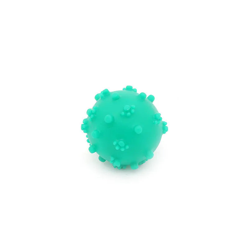 Bright blue, green, pink, and yellow spiky dog balls for small puppy teething and play.