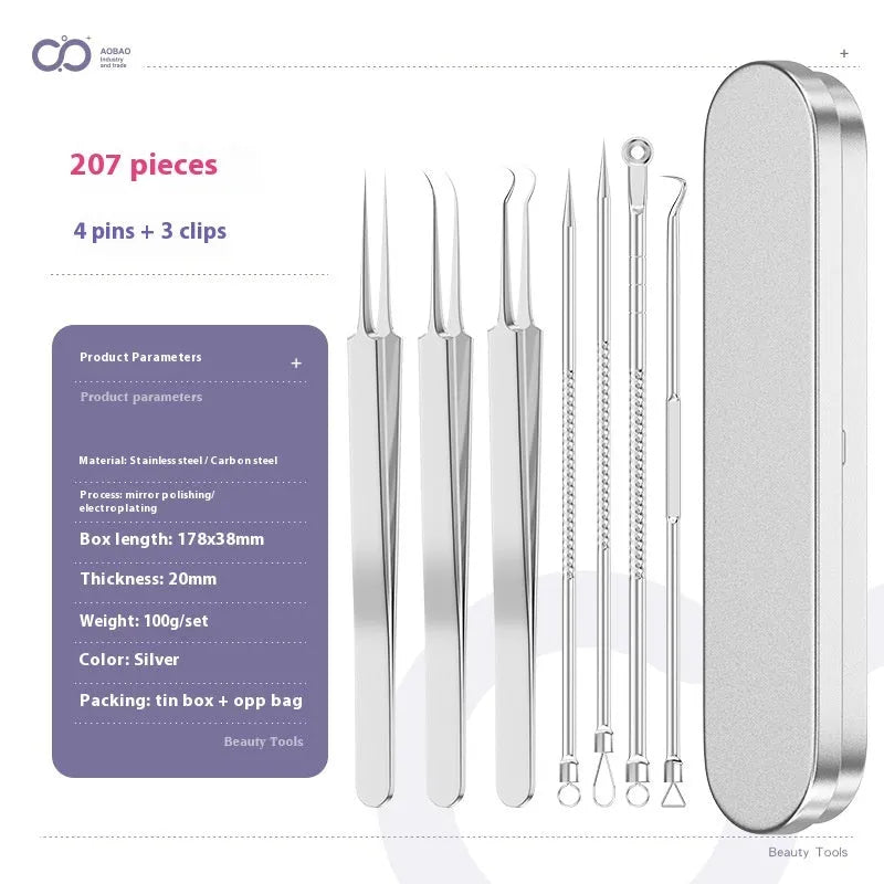Four silver metal acne needles with pointed tips laid out on a flat surface.