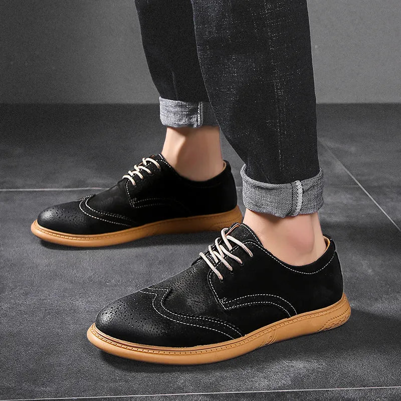 Men's black genuine cowhide leather lace-up business shoes with rubber sole on a grey background.