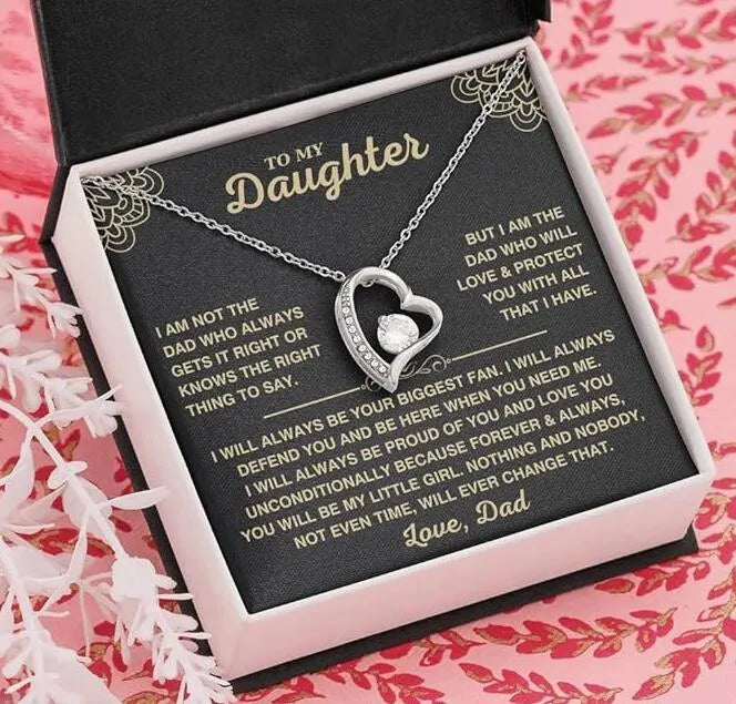 Hollow heart-shaped pendant necklace in silver or gold tone with mixed material construction and gift packaging