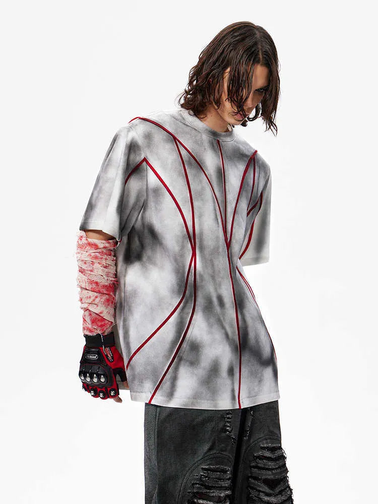 Women's padded shoulder short sleeve T-shirt with textured line patchwork design on front.