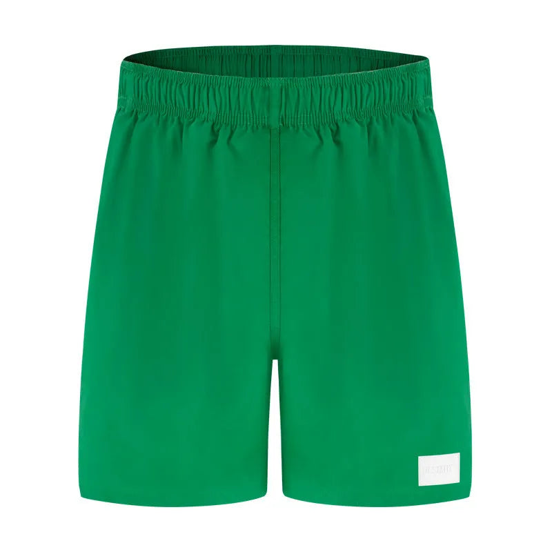 Men's quick-dry nylon sports shorts in solid colours with straight leg design
