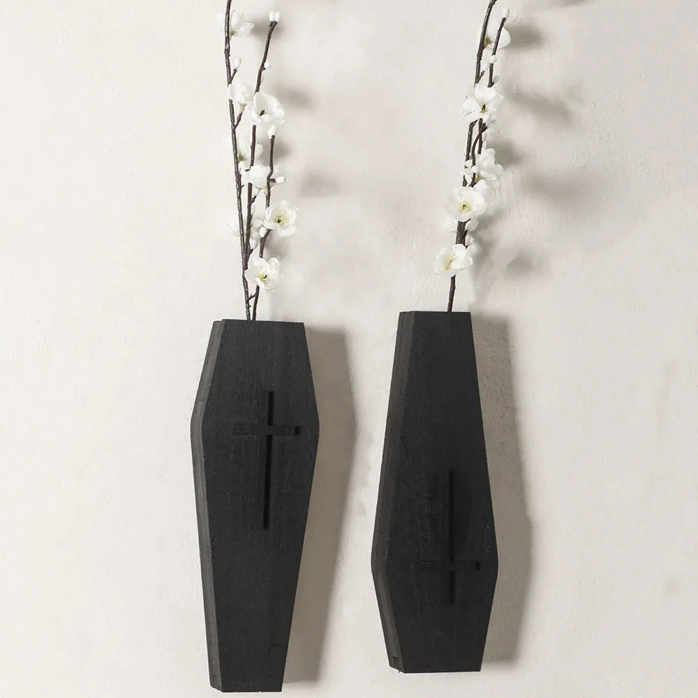 Black wooden cross-shaped wall shelf decoration measuring 27cm by 9cm