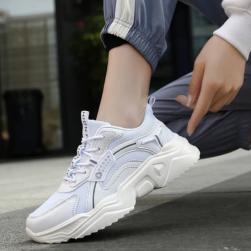 Women's white chunky casual sports shoes with mesh upper and thick mid-heel sole.