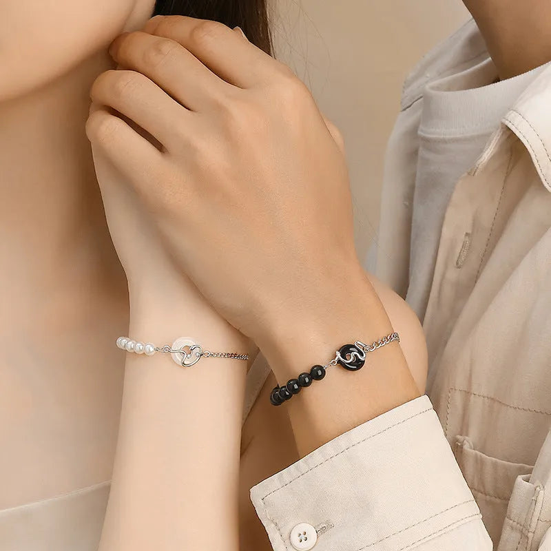 925 sterling silver couple bracelet with snake design and obsidian pearl accents on security buckle