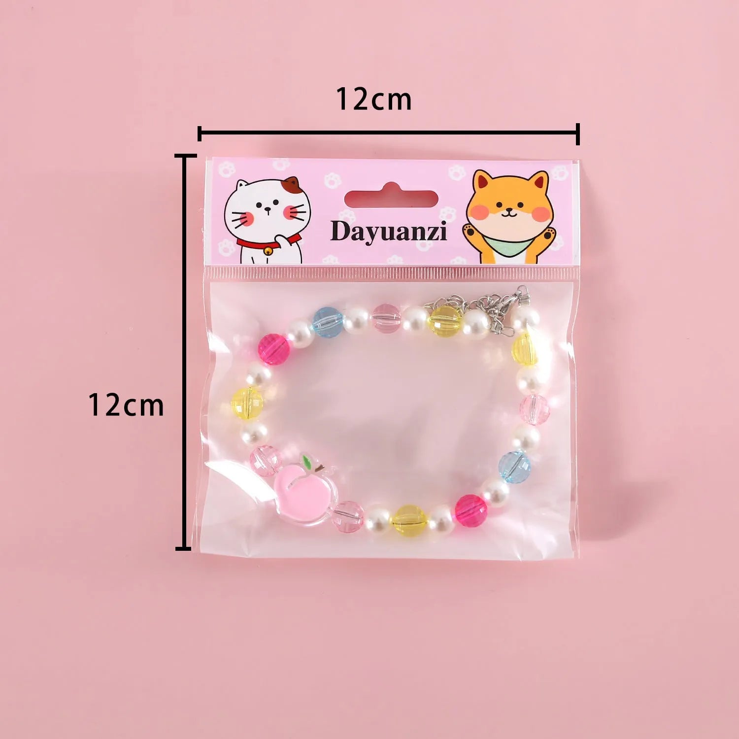 Colourful plastic pearl bead cat necklace with small flower, rainbow, or peach designs on a white background.