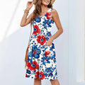 Women's sleeveless short dress with floral print in various colours like red, blue, and green on a white background