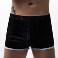 Men's black boxer shorts showing three-point ventilation panels and a mid-waist design.