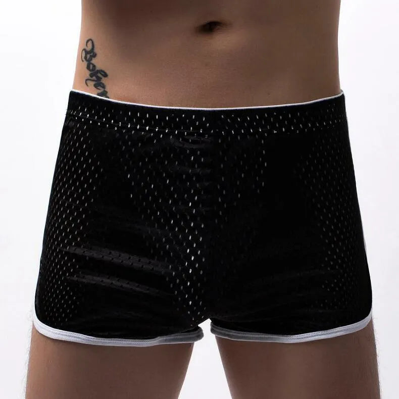Men's black boxer shorts showing three-point ventilation panels and a mid-waist design.
