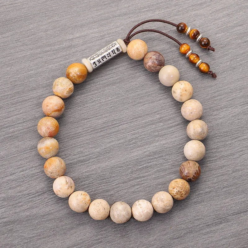 Handmade stone bead bracelet in wood colour on a simple background, showing retro style design.