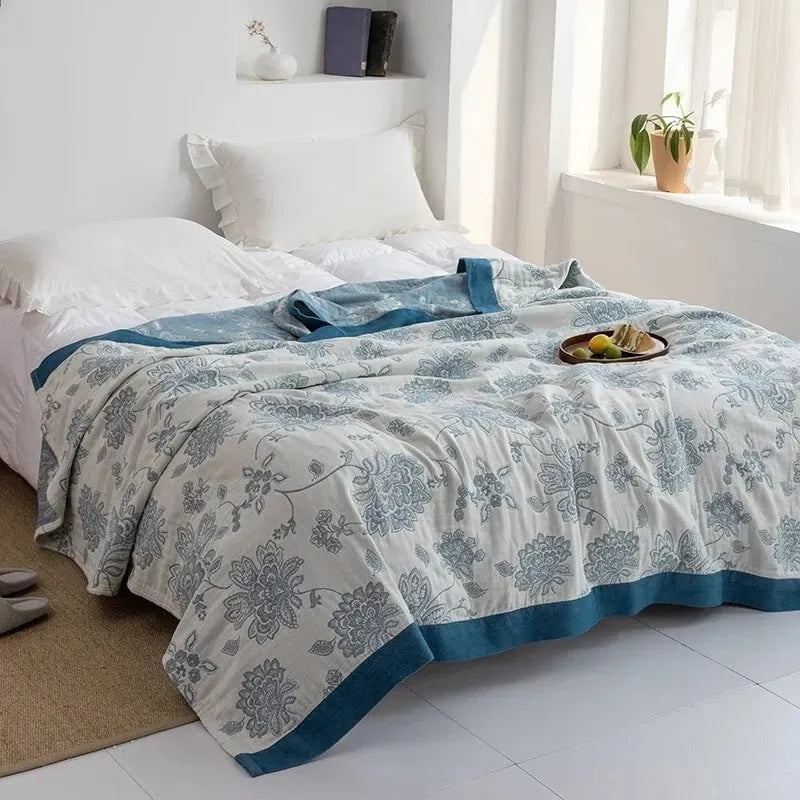 Pure cotton five-layer gauze bed sheet blanket in roulette wheel blue, showing modern simplicity pattern.