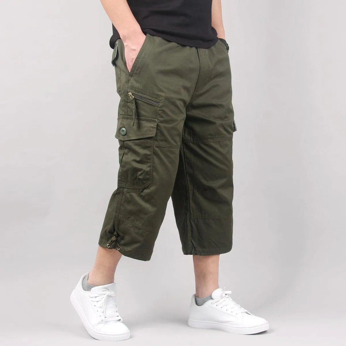 Man wearing loose khaki cotton cropped casual pants for sports.