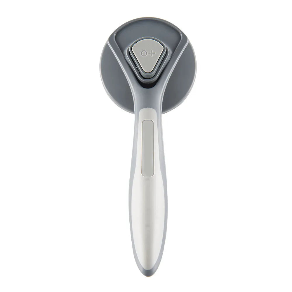 Grey self-cleaning pet slicker brush with massage-tipped bristles and a cleaning button on the handle