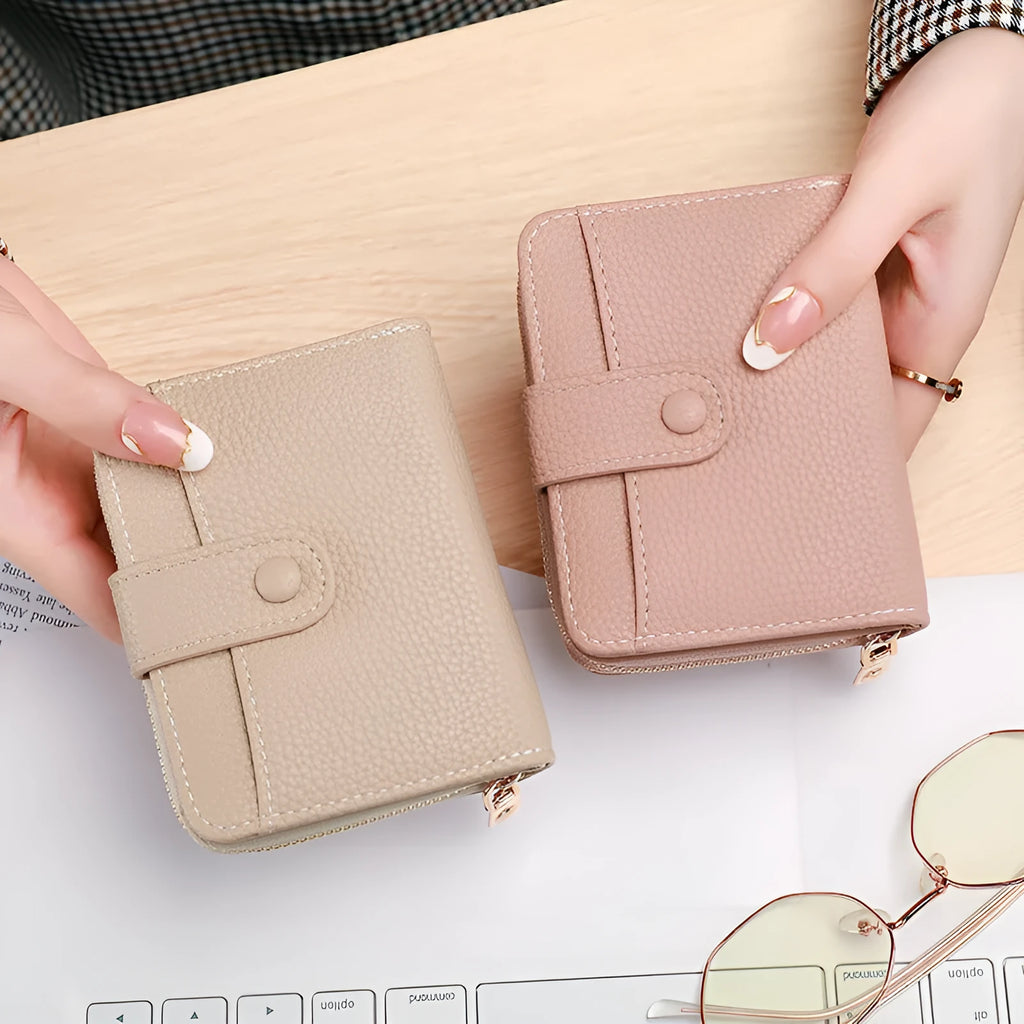 Women's short PU leather wallet with lychee pattern in beige, pink, black, or red.