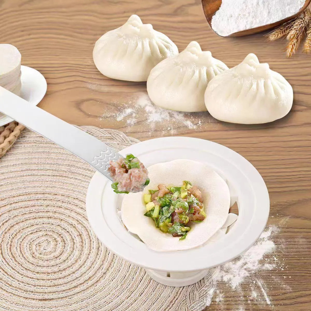 Set of four black steamed bun moulds for shaping baozi and dumplings.