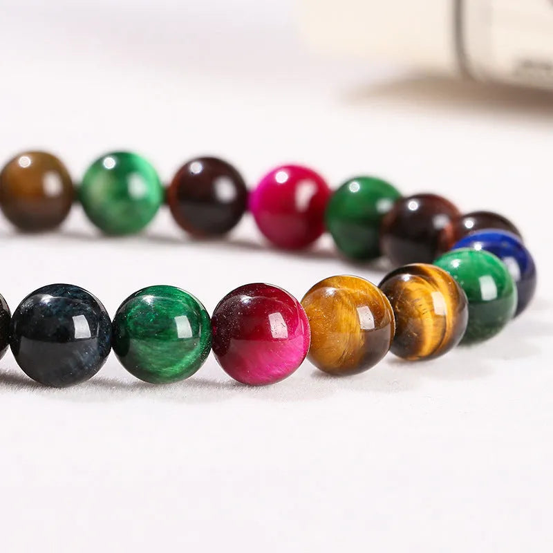 Women's colourful tiger eye stone bracelet with round beads on a string, showing size options.