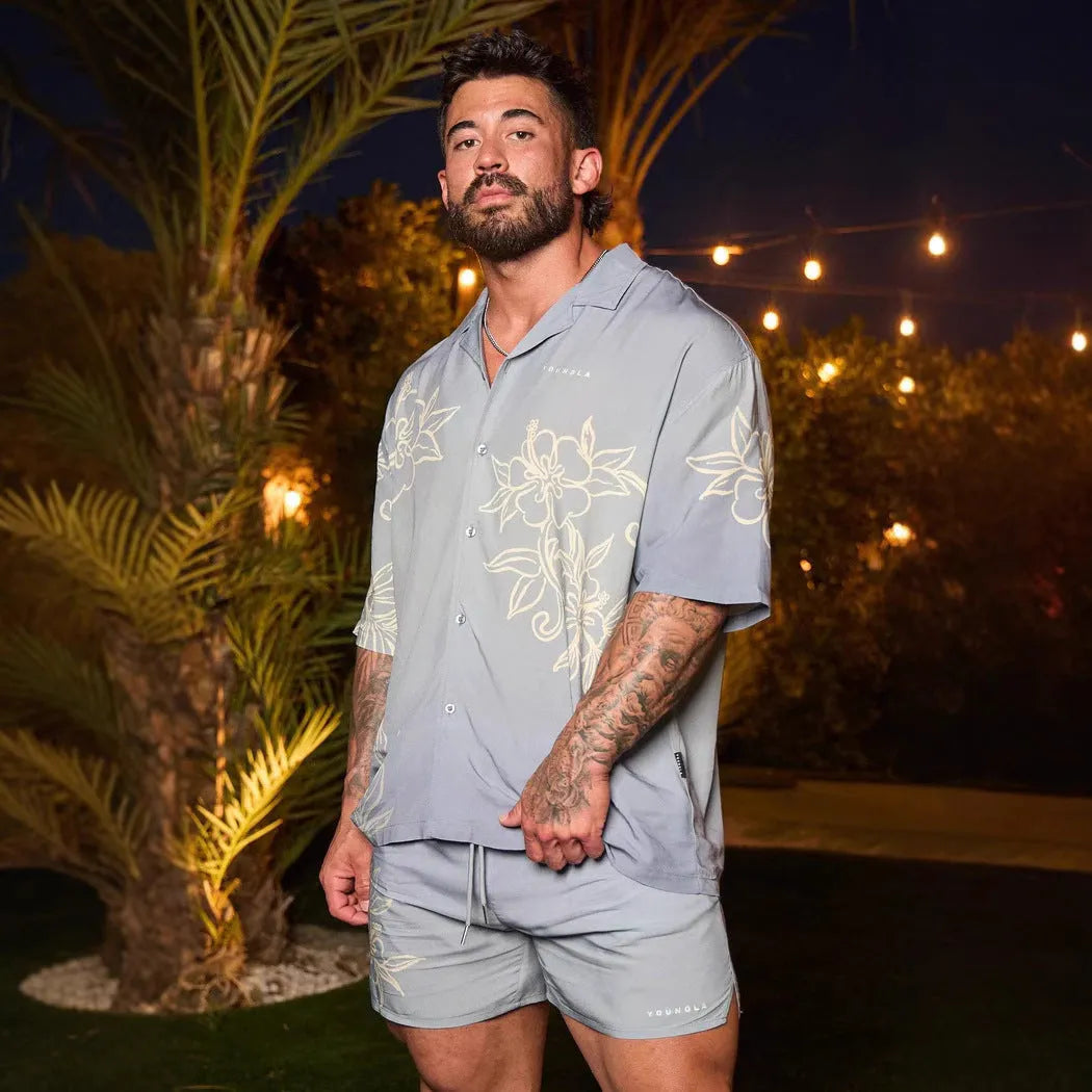 Men's loose fitting short sleeve top with floral print pattern in lightweight polyester fabric