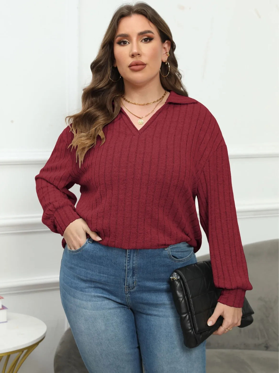 Women's plus size grey polo collar fleece shirt with lantern sleeves on a hanger