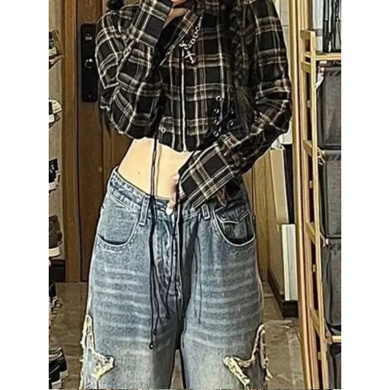 Blue women's cotton denim wide-leg trousers with a high waist on a size chart.