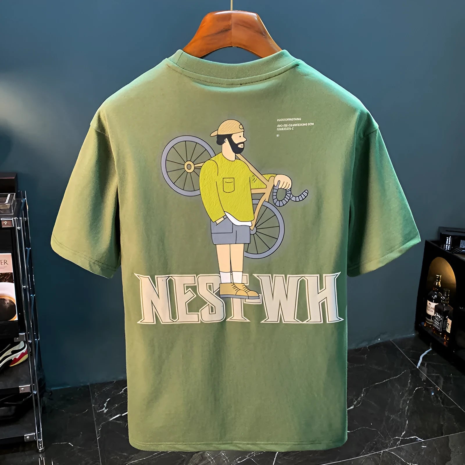 Green men's loose fit t-shirt with trendy printed design and short sleeves
