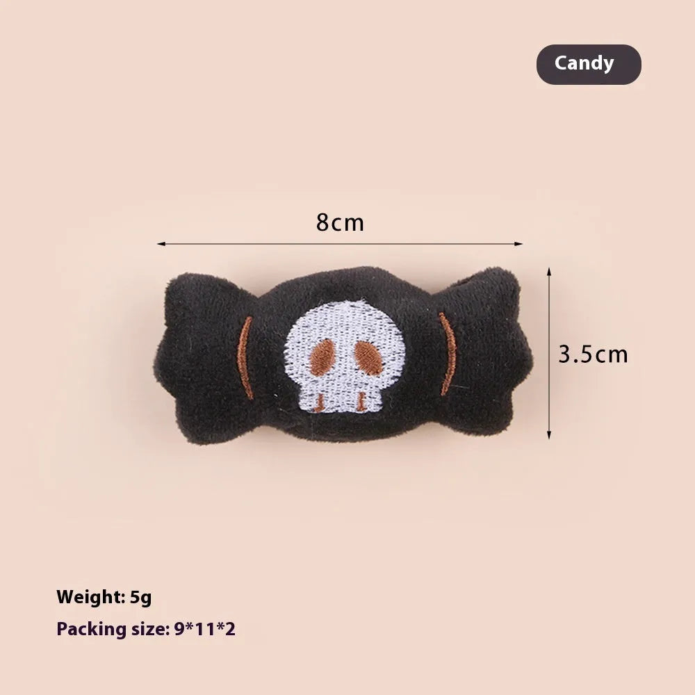 Colourful plush cat tease stick with candy, eyes and skull designs on small wand toy