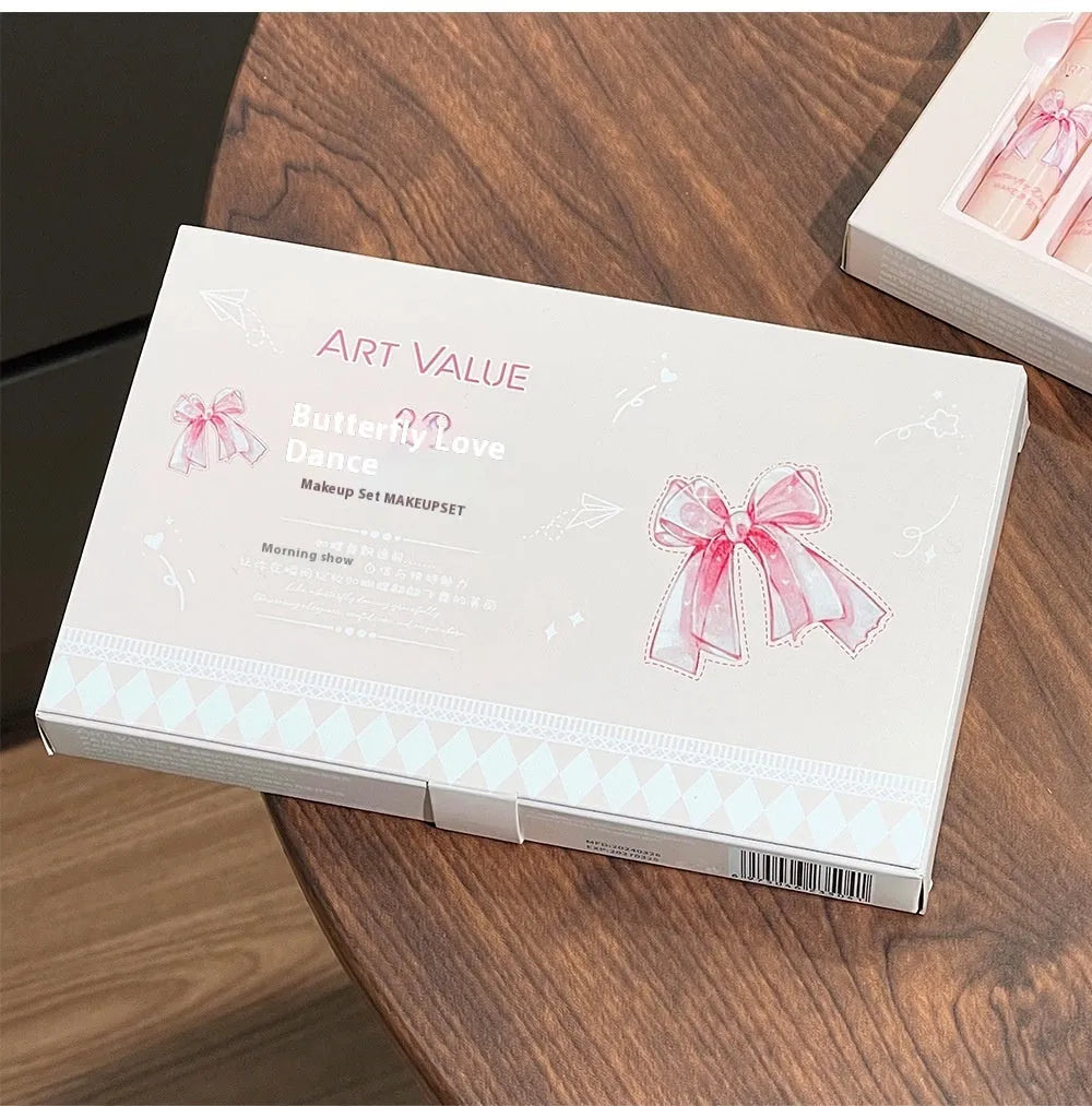 Butterfly Box makeup collection showing pink lip muds, powder blusher and matching necklace