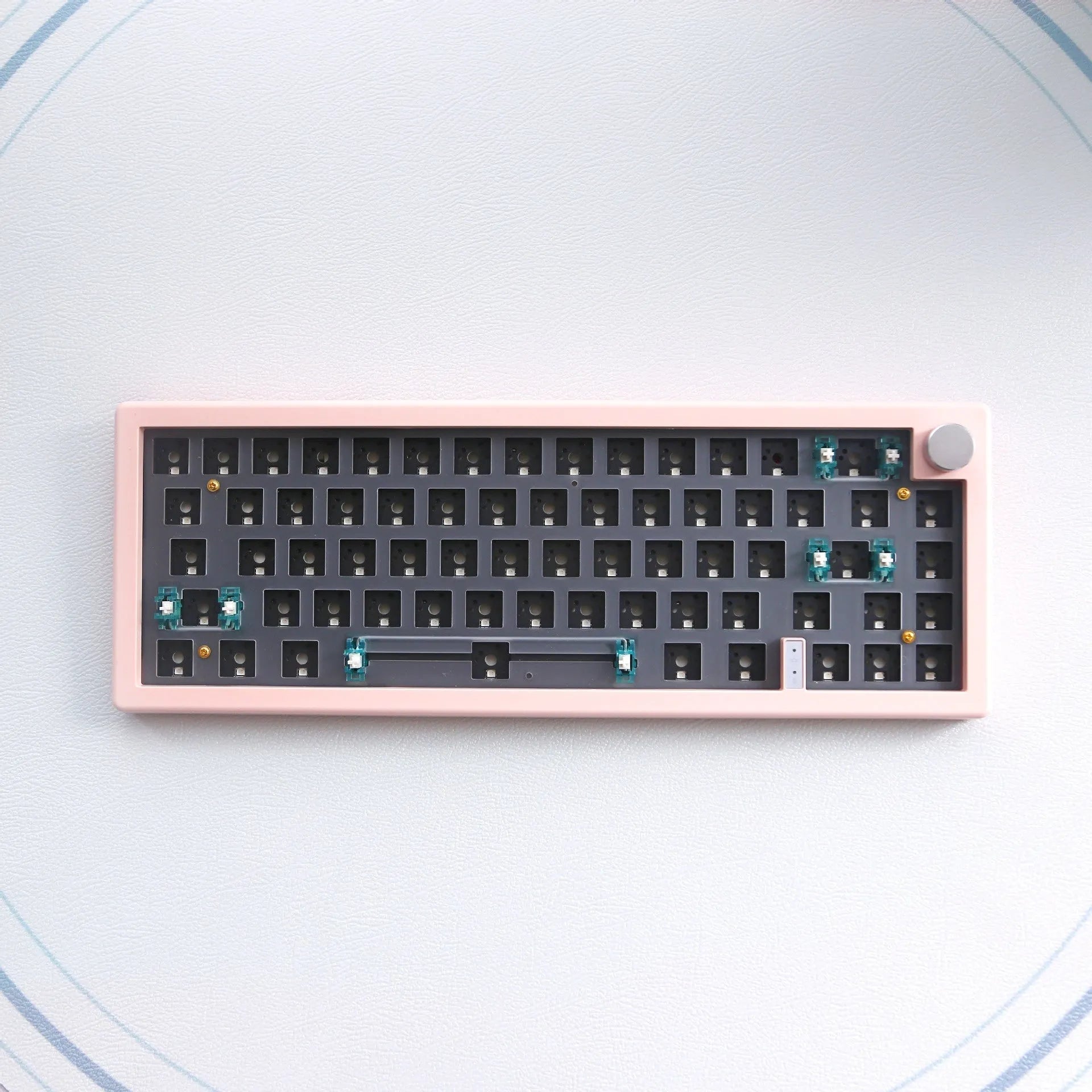 DIY mechanical keyboard kit with RGB lighting in seven colour options showing compact 40cm design