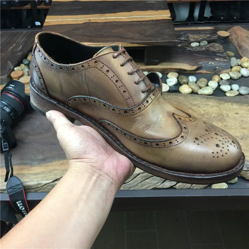 Light brown men's vintage distressed leather shoes with engraved detailing and lace-up closure