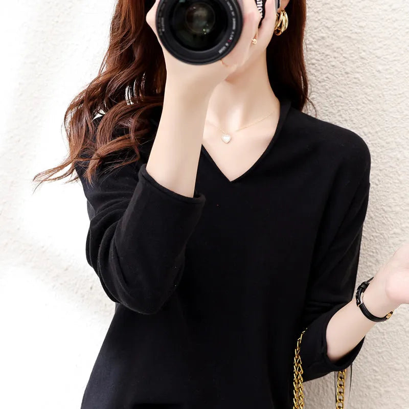 Women's long sleeve V-neck knitwear pullover top in a choice of ten colours on a hanger.