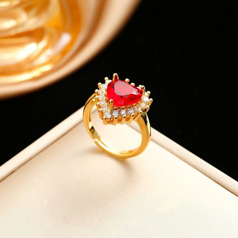 Gold red titanium steel necklace with hearts flower pendant and mixed gemstone inlay, matching ring and earrings.