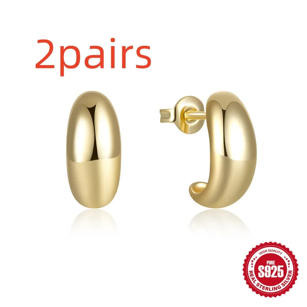 Sterling silver C-shaped stud earrings with glossy electroplated finish in gold or silver tone