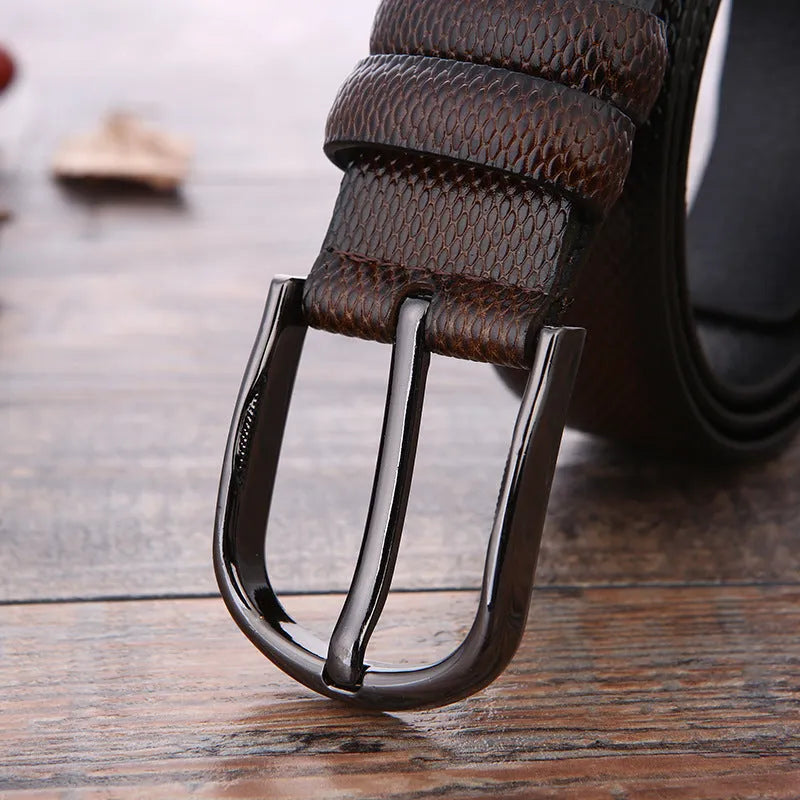 Men's business belt showing laser pattern detail with alloy pin buckle on imitation leather strap
