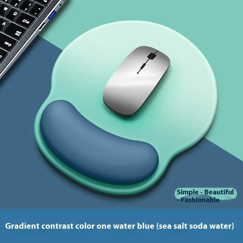 Silicone mouse mat with wrist rest in gradient colour pattern on desk