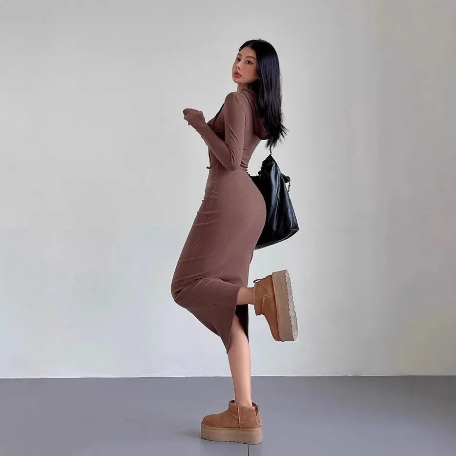 Women's grey hooded long sleeve sheath dress with high waist on a mannequin.