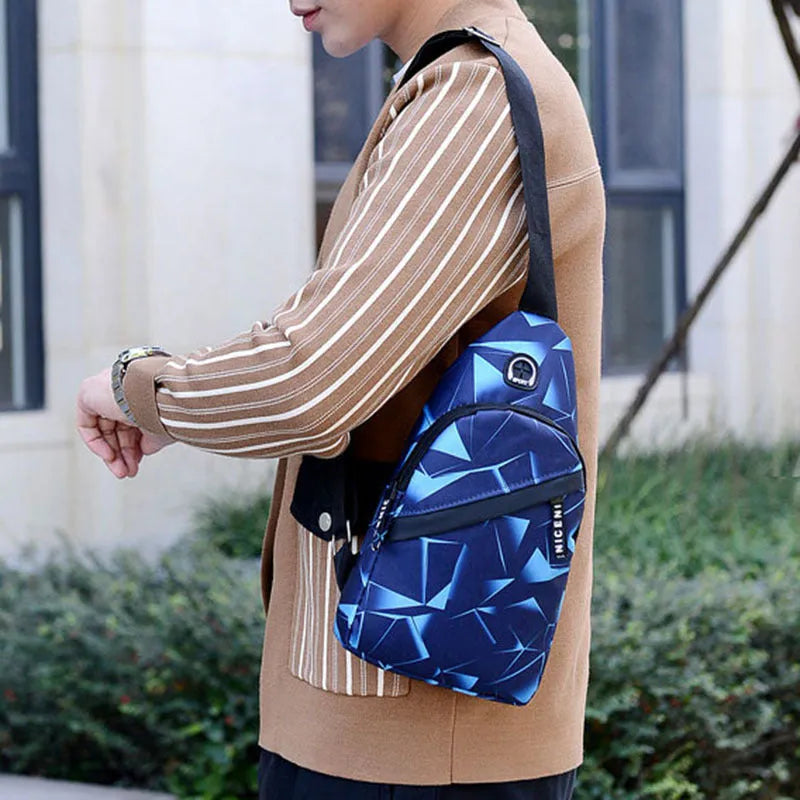 Men's Oxford cloth sling chest bag with earphone hole showing crossbody strap and zipper closure