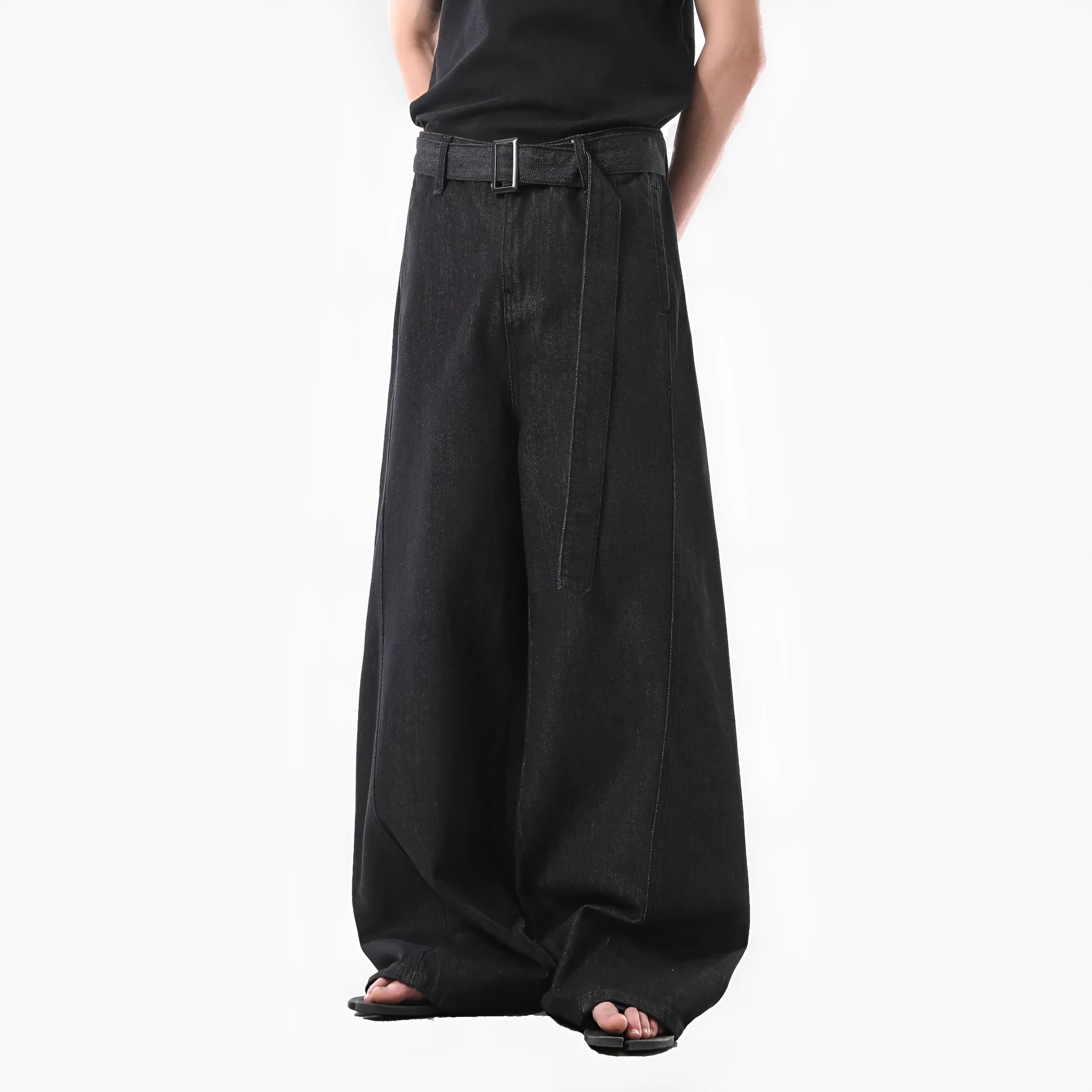 Black high waist straight leg denim jeans on a neutral background.