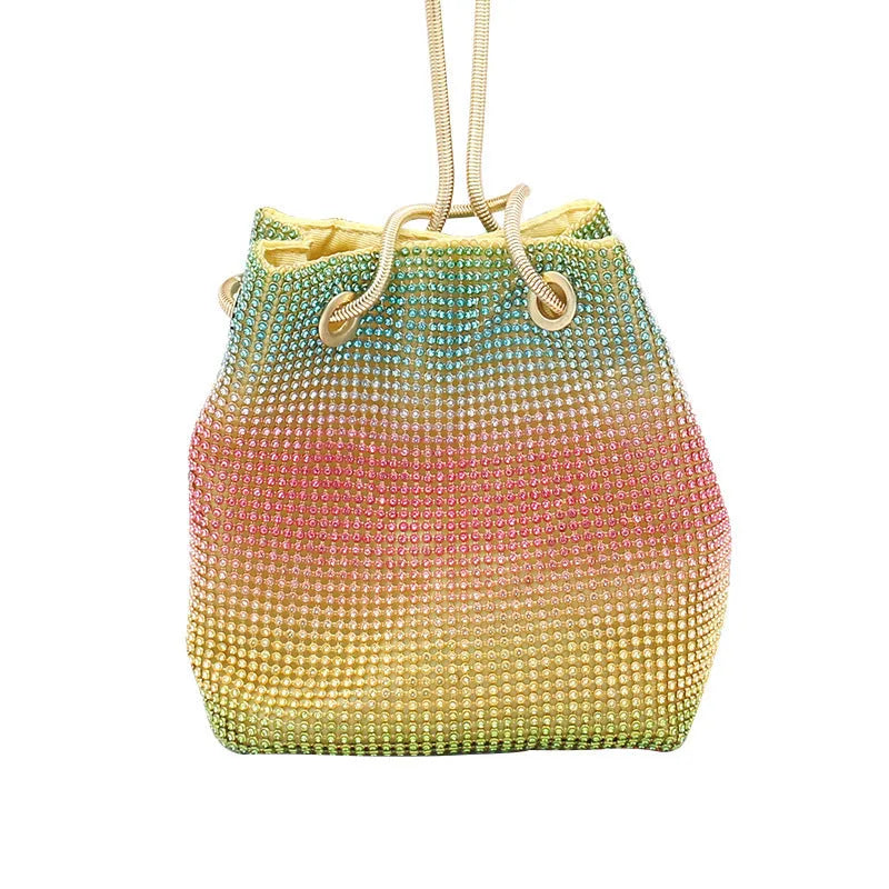 Colourful rhinestone fabric bucket bag with a sparkling jewelled shoulder strap on a white background
