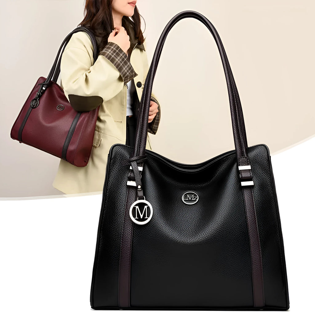 Woman holding a large soft black PU leather retro crossbody bag with double shoulder straps.