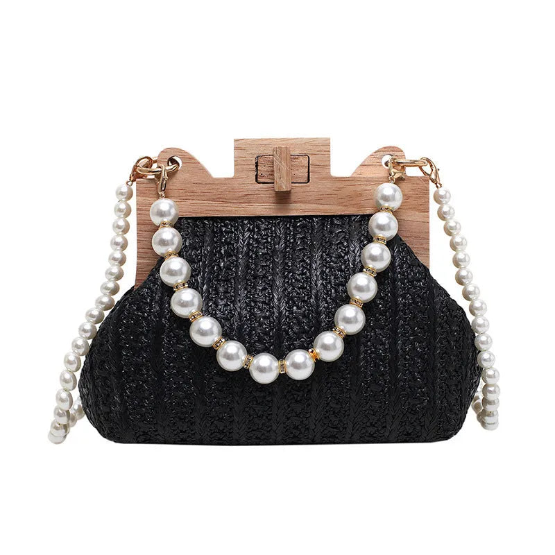 Women's straw shoulder bag with pearl chain strap in beige colour showing organised interior with compartments