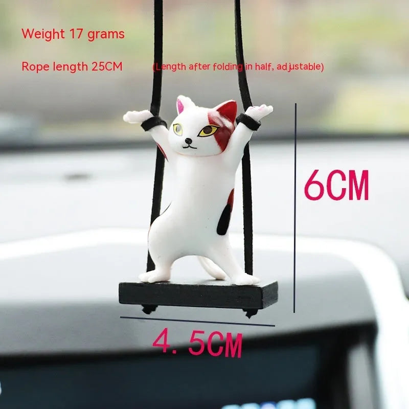 Cartoon style resin cat pendant on a rope for hanging in a car, shown in multiple colour options.