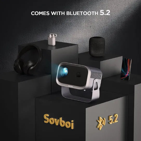 White portable Android smart home theatre projector on a wooden table, projecting a high-definition movie scene.