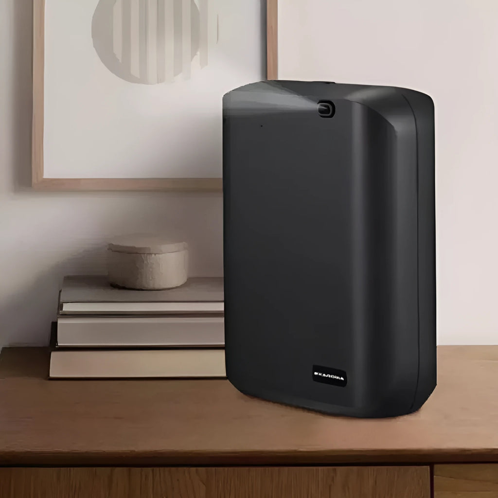 White smart wall mount essential oil diffuser with 150ml tank on a beige wall.
