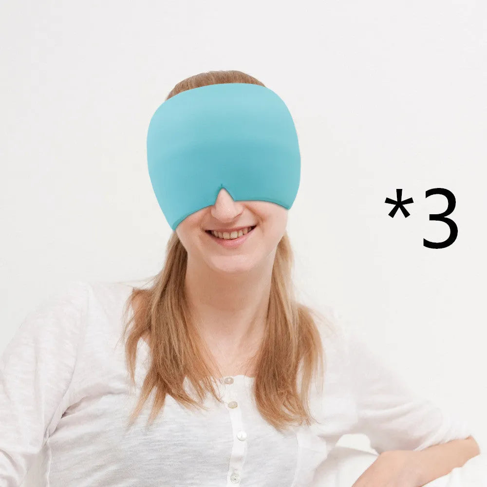 Black elastic cloth gel cold therapy eye mask for headache relief on grey background.