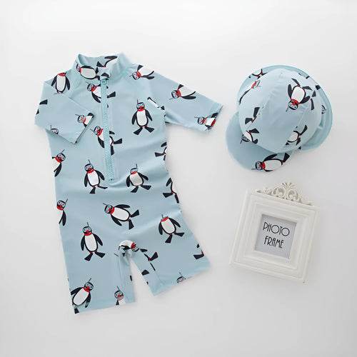 Boys' penguin print long sleeve one-piece swimsuit with matching swimming cap set.