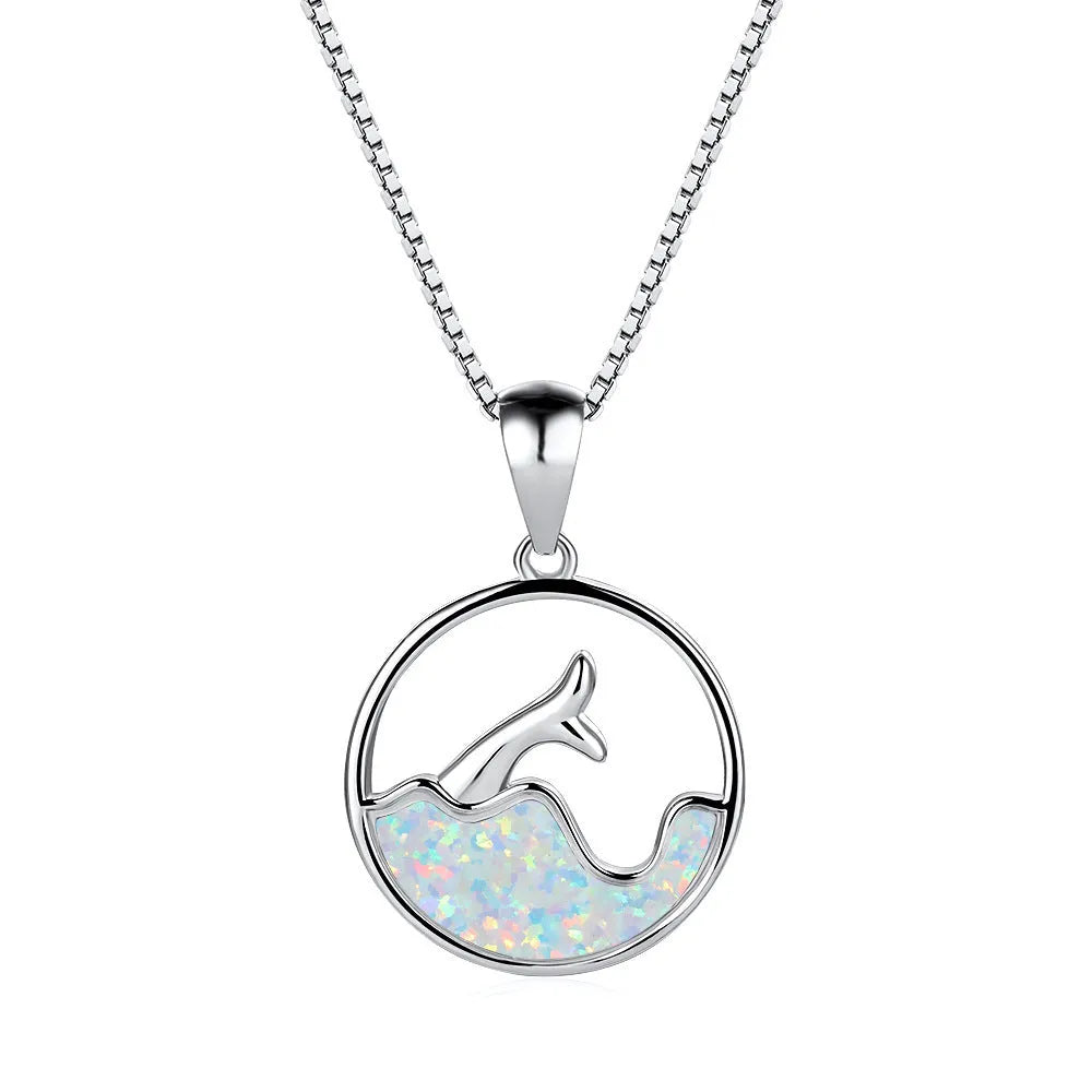 Geometric fishtail pendant necklace with a round blue opal stone on an adjustable silver-tone chain.