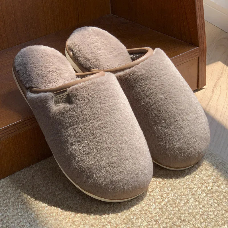 PVC non-slip winter slipper in a solid colour on a wooden floor.