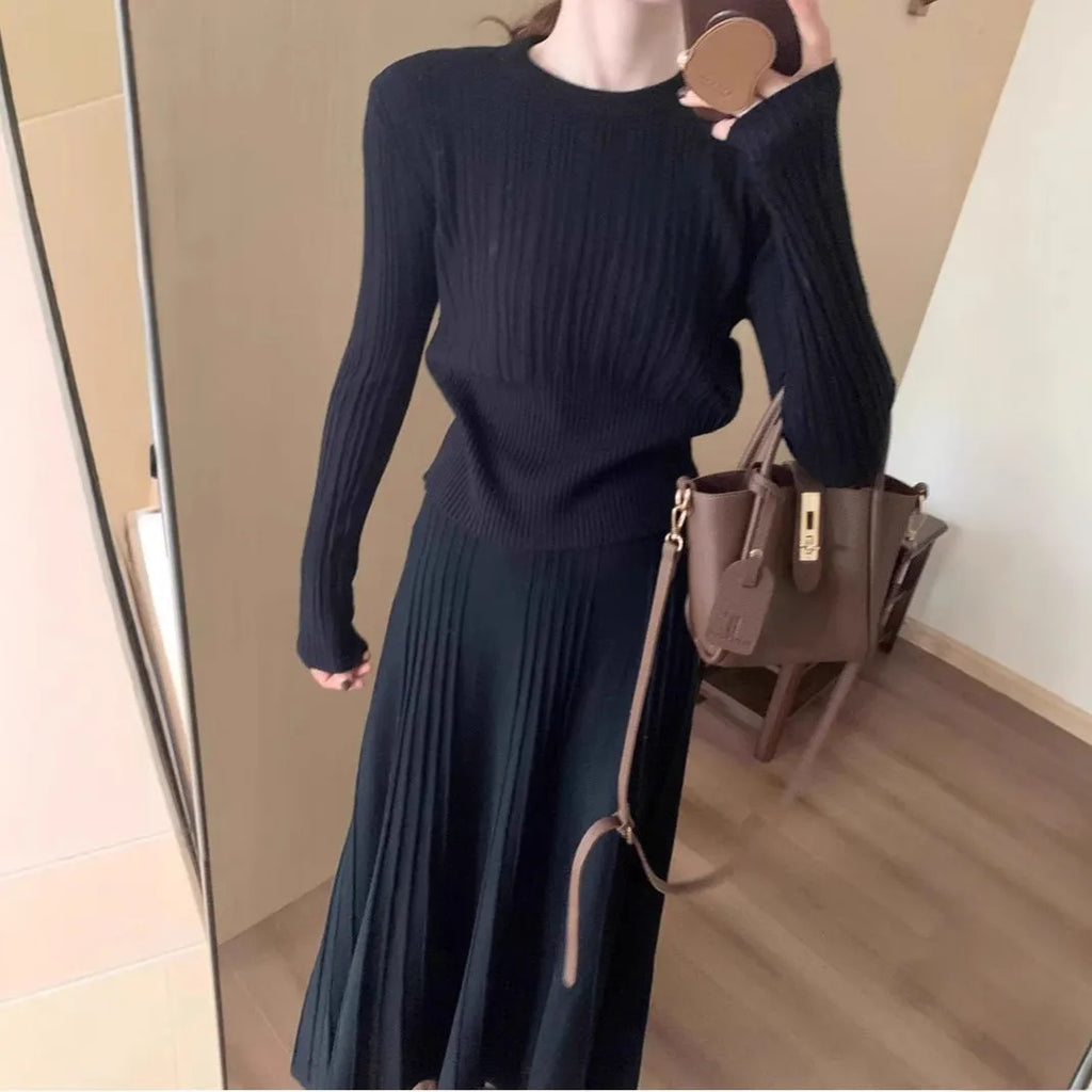 Women's dark grey knitted two-piece suit with artistic collage stitching and retro ethnic style.
