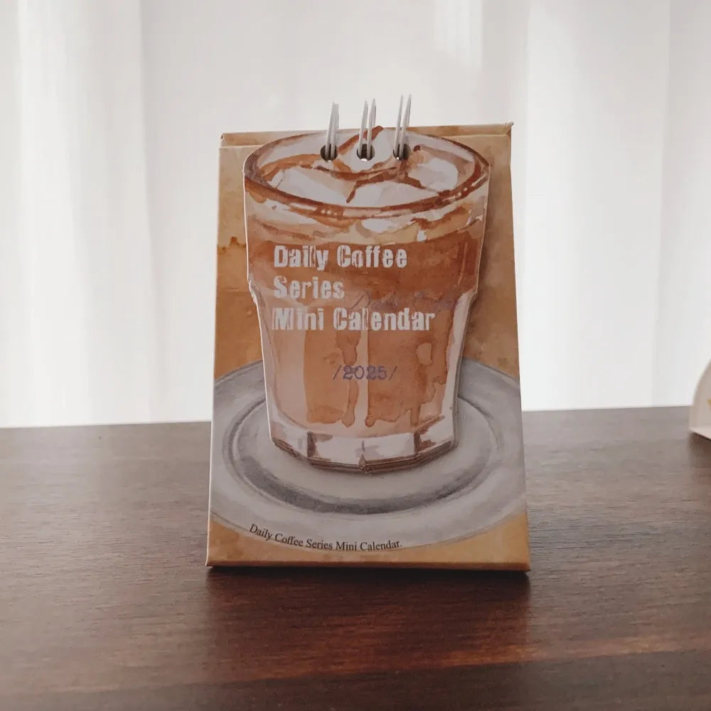 Mini coffee-themed desk calendar for 2025 showing daily pages and simple modern design