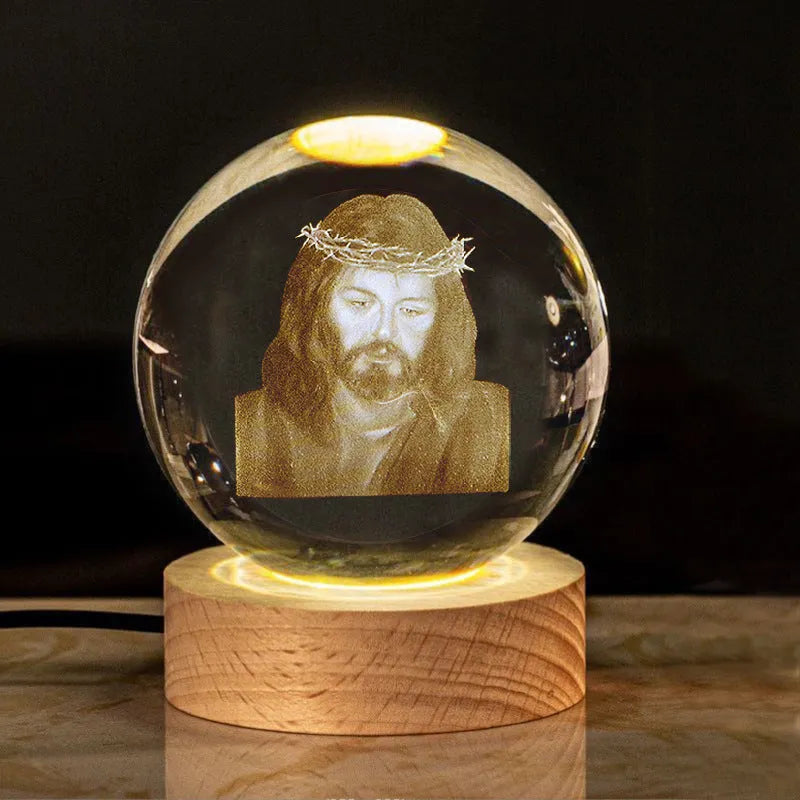 White crystal lamp with 6cm diameter orb on solid wood warm light base showing religious ornamentation